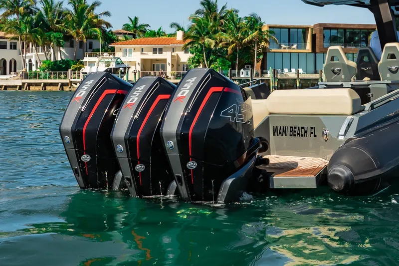 Slide: The Image of Skipper-BSK 38NC boat with triple outboard engines in Miami Beach, 2023. - 34