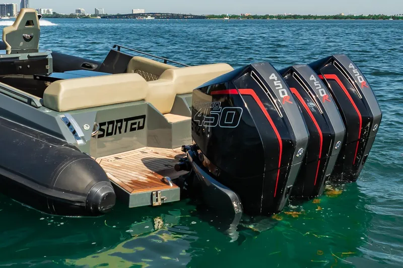 Slide: The Image of 2023 Skipper-BSK 38NC boat with triple 450R engines on clear water. - 37