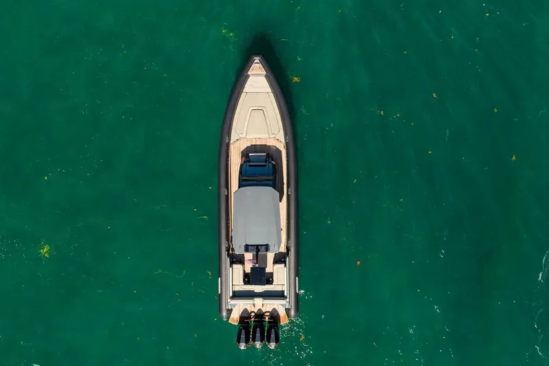 Slide: The Image of Aerial view of 2023 Skipper-BSK 38NC boat on clear turquoise water. - 40