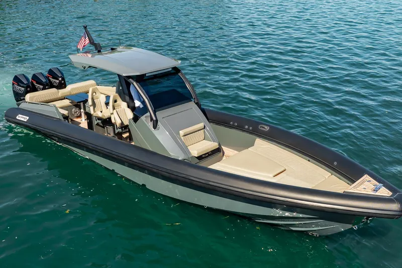 Slide: The Image of 2023 Skipper-BSK 38NC boat on clear blue water, featuring sleek design and powerful engines. - 51