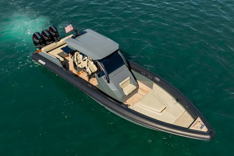 Slide: The Image of 2023 Skipper-BSK 38NC luxury boat on water, featuring sleek design and powerful engines. - 52
