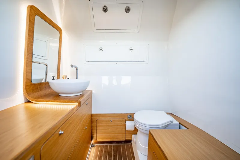Slide: The Image of Modern bathroom interior in 2023 Skipper-BSK 38NC boat, featuring wood accents and sleek fixtures. - 58