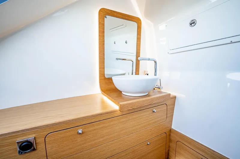 Slide: The Image of Modern bathroom interior on 2023 Skipper-BSK 38NC yacht with wooden cabinetry and sleek sink. - 61