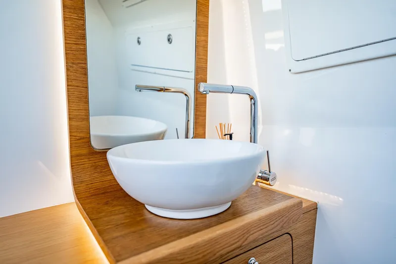 Slide: The Image of Modern bathroom sink with wooden accents on Skipper-BSK 38NC, 2023 model. - 62