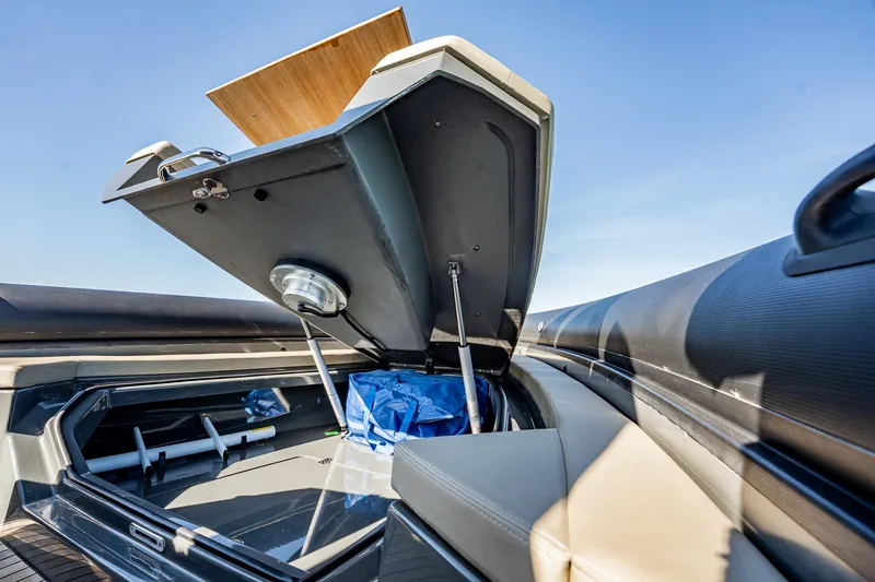 Slide: The Image of Open storage compartment on 2023 Skipper-BSK 38NC boat under clear blue sky. - 66