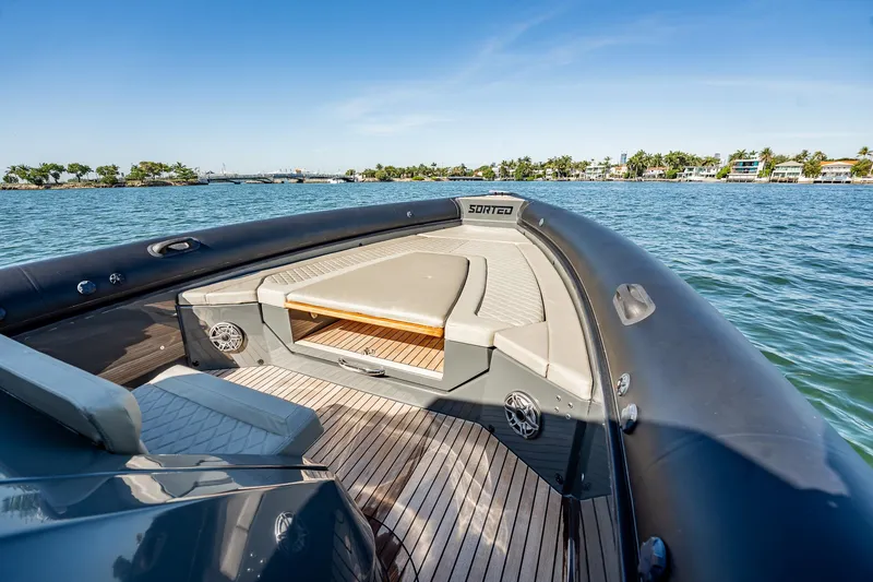 Slide: The Image of Luxury Skipper-BSK 38NC boat, 2023 model, with sleek deck design on calm waters. - 68