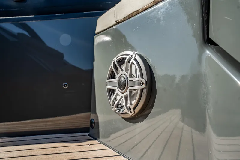 Slide: The Image of Close-up of a 2023 Skipper-BSK 38NC boat speaker on a sleek gray surface. - 69