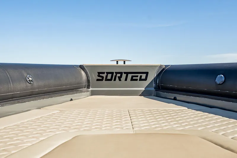 Slide: The Image of 2023 Skipper-BSK 38NC boat deck with "SORTED" branding, featuring cushioned seating. - 70
