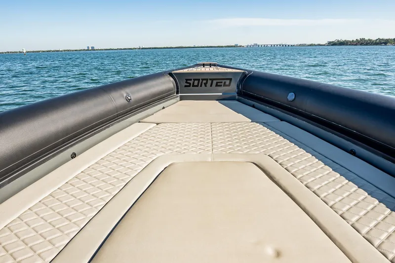 Slide: The Image of 2023 Skipper-BSK 38NC boat deck with quilted seating on open water. - 71