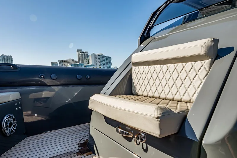 Slide: The Image of Luxurious seating on 2023 Skipper-BSK 38NC boat with city skyline backdrop. - 72