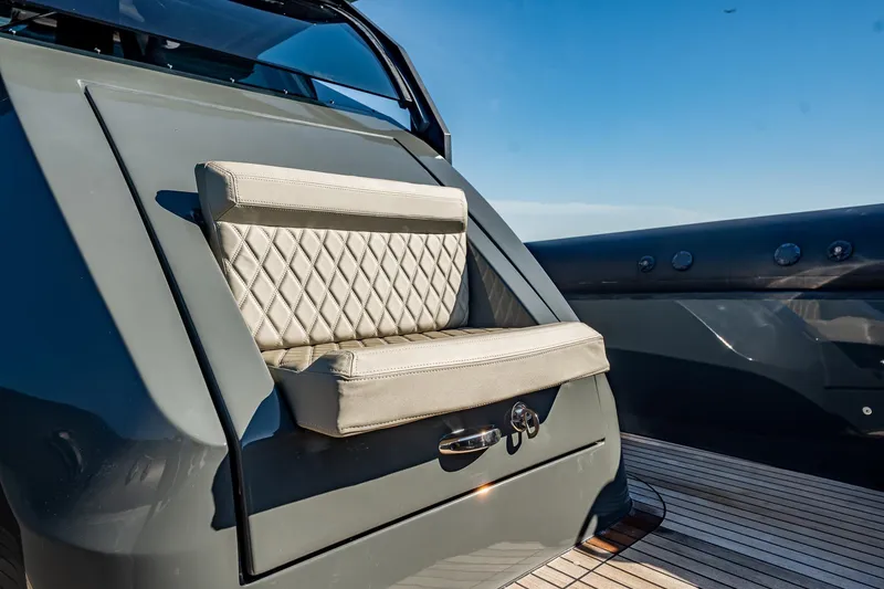 Slide: The Image of Luxury seating on 2023 Skipper-BSK 38NC boat, featuring quilted upholstery and sleek design. - 78