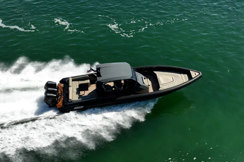 Slide: The Image of 2023 Skipper-BSK 38NC boat cruising swiftly on open water. - 8