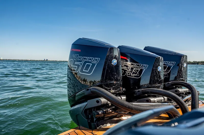 Slide: The Image of Triple Mercury Racing 450 engines on Skipper-BSK 38NC boat, 2023 model, on open water. - 80