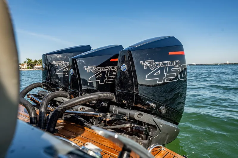 Slide: The Image of Triple Mercury Racing 450 engines on a 2023 Skipper-BSK 38NC boat in open water. - 82