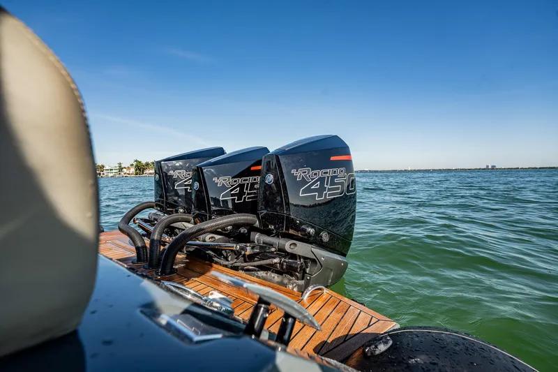 Slide: The Image of Outboard engines on Skipper-BSK 38NC boat, 2023 model, cruising on open water. - 83
