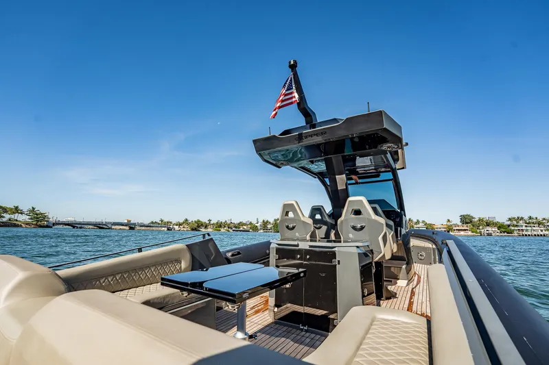 Slide: The Image of 2023 Skipper-BSK 38NC luxury boat with sleek design, cruising on a sunny day. - 84