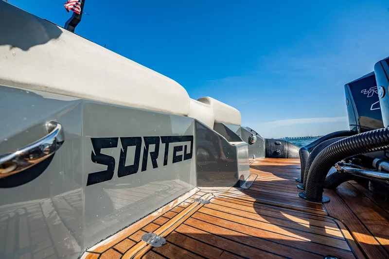 Slide: The Image of Skipper-BSK 38NC 2023 boat deck with "SORTED" branding, featuring sleek design and powerful engines. - 89