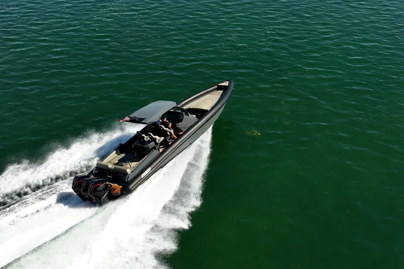 Slide: The Image of 2023 Skipper-BSK 38NC speedboat cruising on open water. - 9