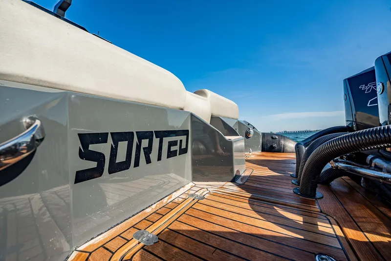 Slide: The Image of 2023 Skipper-BSK 38NC boat deck with "SORTED" branding, featuring sleek design and powerful engines. - 90