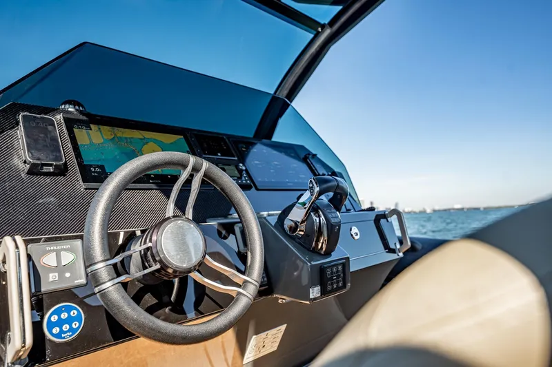 Slide: The Image of Helm of 2023 Skipper-BSK 38NC boat with navigation controls and sea view. - 96