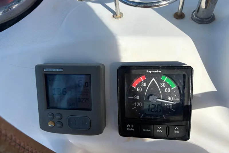 Slide: The Image of Beneteau Oceanis 46 (2010) sailing instruments displaying depth and wind speed. - 11