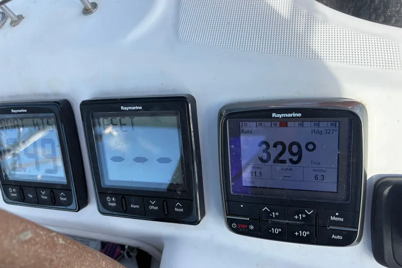 Slide: The Image of Raymarine navigation instruments on a 2010 Beneteau Oceanis 46 yacht dashboard. - 12