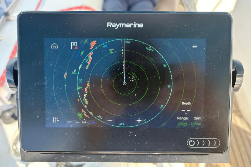 Slide: The Image of Raymarine radar display on 2010 Beneteau Oceanis 46 sailboat, showing navigation data. - 13