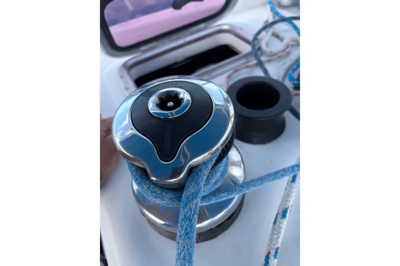 Slide: The Image of Winch on 2010 Beneteau Oceanis 46 sailboat with blue rope. - 18