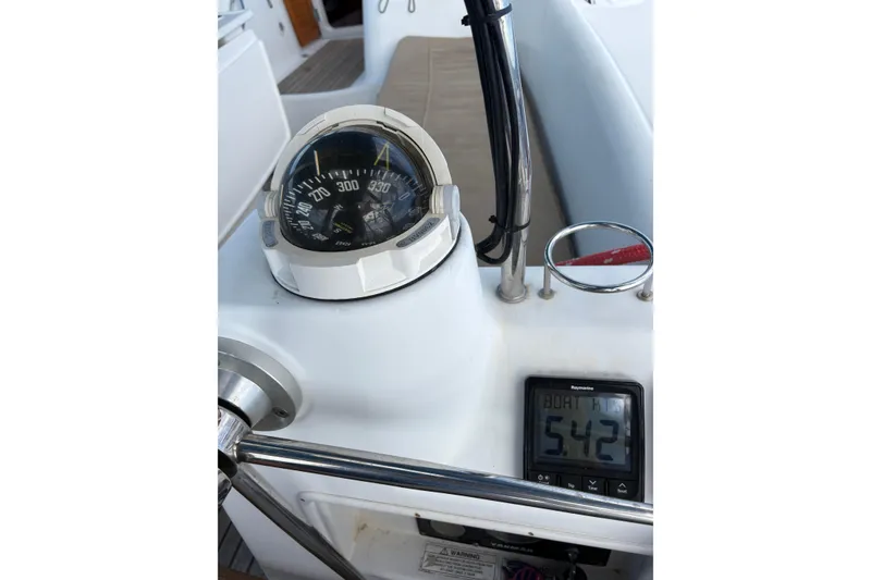 Slide: The Image of Compass and speedometer on 2010 Beneteau Oceanis 46 yacht dashboard. - 19