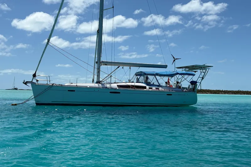 Slide: The Image of Sailing yacht Beneteau Oceanis 46, 2010 model, anchored in clear turquoise waters. - 20