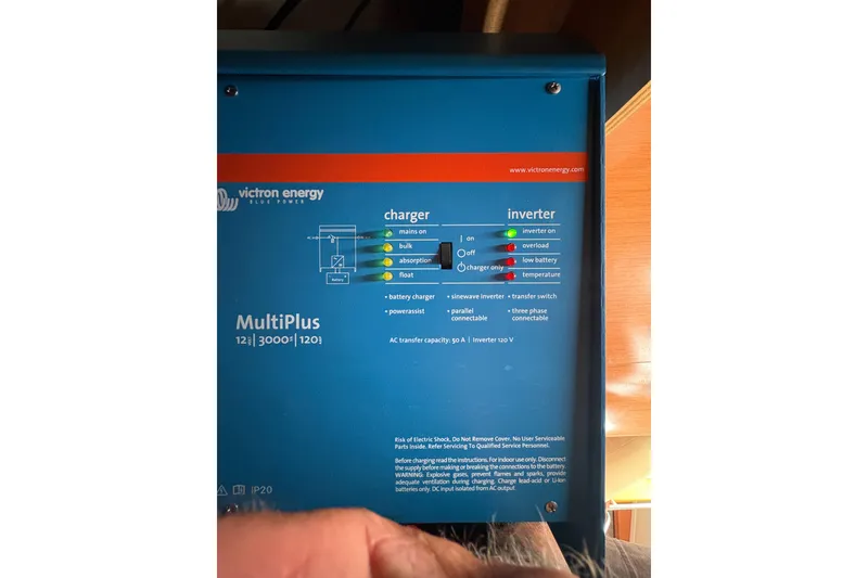 Slide: The Image of Victron Energy MultiPlus inverter on 2010 Beneteau Oceanis 46 yacht, showing control panel and indicators. - 27