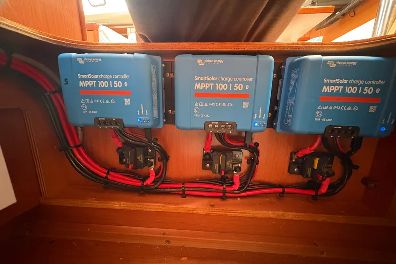 Slide: The Image of SmartSolar charge controllers in a 2010 Beneteau Oceanis 46 yacht, neatly installed with wiring. - 29