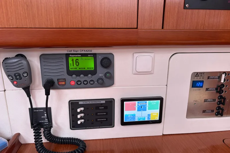 Slide: The Image of Control panel of a 2010 Beneteau Oceanis 46 yacht with navigation and communication equipment. - 36