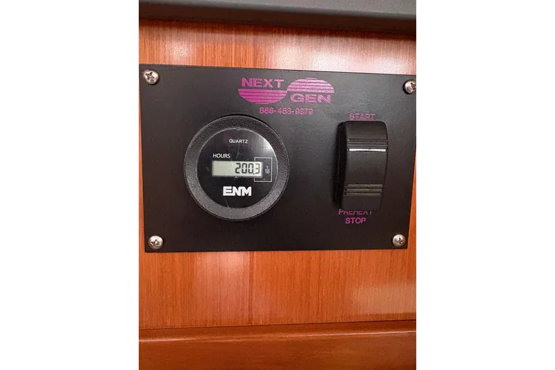 Slide: The Image of Hour meter panel on 2010 Beneteau Oceanis 46 sailboat, showing 2003 hours. - 41