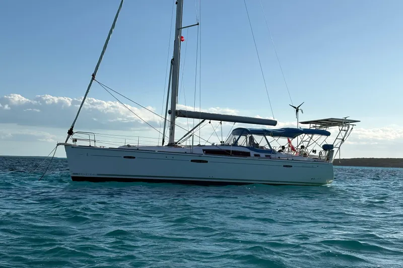 Slide: The Image of Sailing yacht Beneteau Oceanis 46, 2010 model, anchored on calm blue waters. - 5