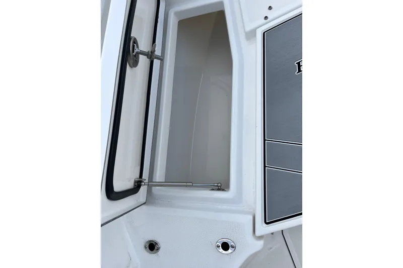 Slide: The Image of 2019 Blackfin 272 CC boat storage compartment with open hatch and hydraulic support. - 36