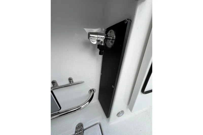 Slide: The Image of 2019 Blackfin 272 CC boat interior detail with chrome fittings and black panel. - 39