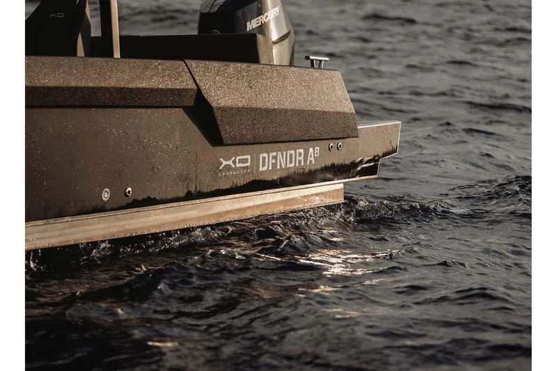 Slide: The Image of XO DFNDR A8 boat cruising on water, showcasing sleek design and modern features, 2027 model. - 12