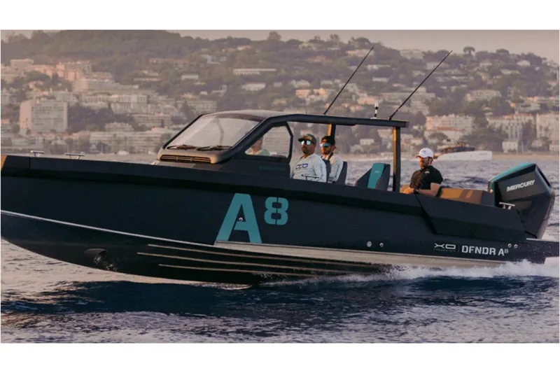 Slide: The Image of 2027 XO DFNDR A8 boat cruising on water with cityscape background. - 4