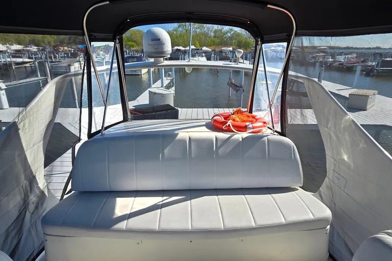 Slide: The Image of Interior view of a 2006 Carver 36 Mariner boat with seating and life preserver. - 15
