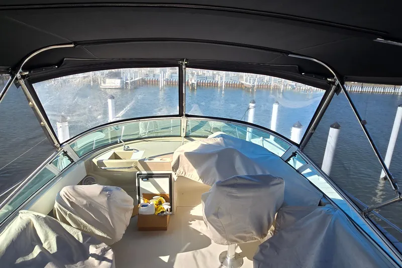 Slide: The Image of 2006 Carver 36 Mariner yacht interior with covered seating, docked at marina. - 17
