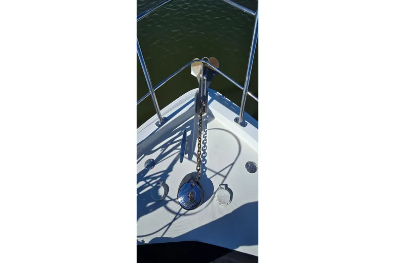 Slide: The Image of Bow of 2006 Carver 36 Mariner yacht with anchor chain and railing. - 19