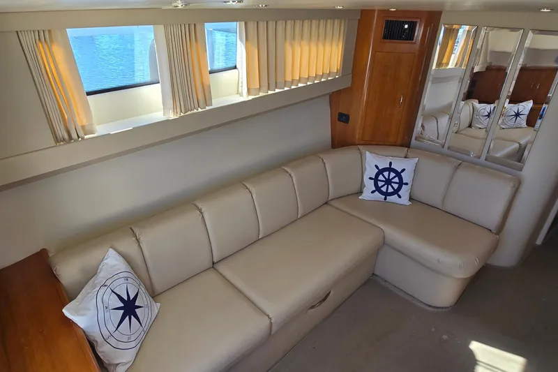Slide: The Image of Luxurious interior of 2006 Carver 36 Mariner yacht with beige seating and nautical decor. - 27