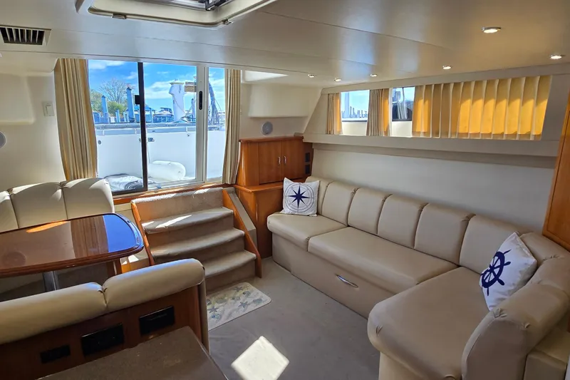 Slide: The Image of Luxurious interior of 2006 Carver 36 Mariner yacht with plush seating and natural light. - 29