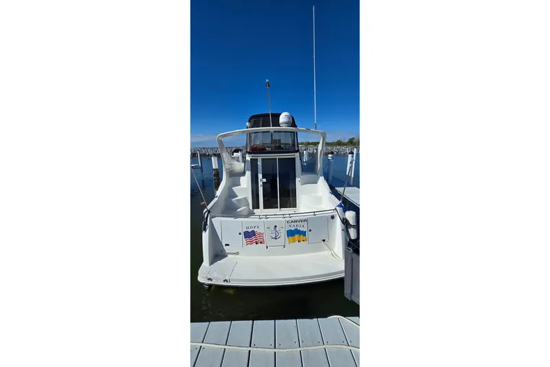 Slide: The Image of 2006 Carver 36 Mariner yacht docked at marina, rear view. - 3