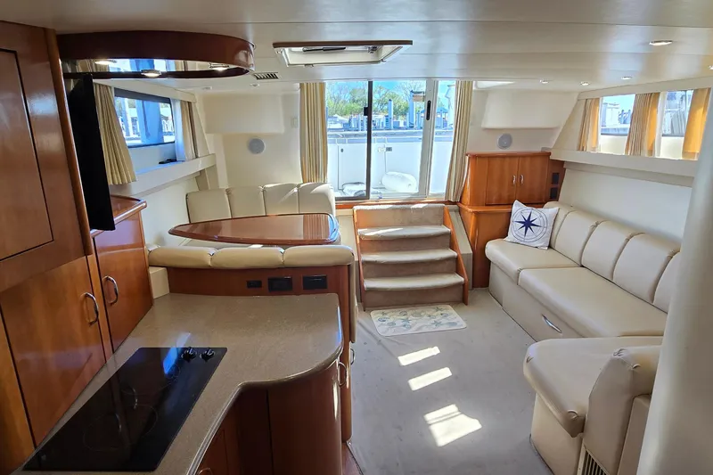 Slide: The Image of Luxurious interior of 2006 Carver 36 Mariner yacht with elegant seating and modern amenities. - 33