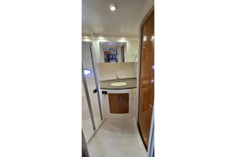 Slide: The Image of 2006 Carver 36 Mariner yacht bathroom with sink and wooden cabinetry. - 34