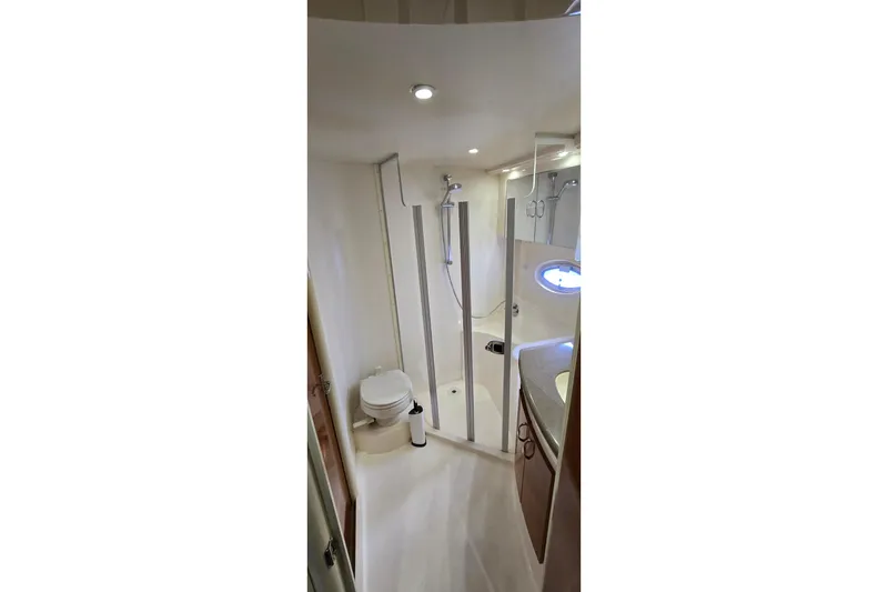 Slide: The Image of Bathroom interior of 2006 Carver 36 Mariner yacht, featuring shower and toilet. - 40