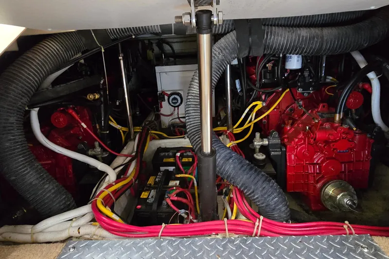 Slide: The Image of Engine room of a 2006 Carver 36 Mariner with visible wiring and components. - 44
