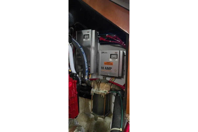 Slide: The Image of Electrical components inside a 2006 Carver 36 Mariner boat engine compartment. - 45